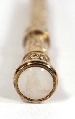 Lot 567 - A yellow metal scroll engraved propelling...