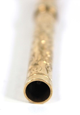 Lot 567 - A yellow metal scroll engraved propelling...