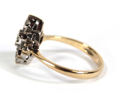 Lot 568 - A 9ct yellow gold cluster ring set five small...