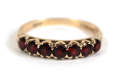 Lot 569 - A 9ct yellow gold half eternity ring set...