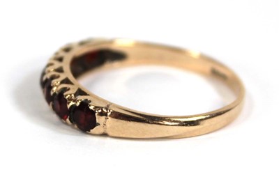 Lot 569 - A 9ct yellow gold half eternity ring set...