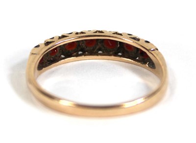 Lot 569 - A 9ct yellow gold half eternity ring set...