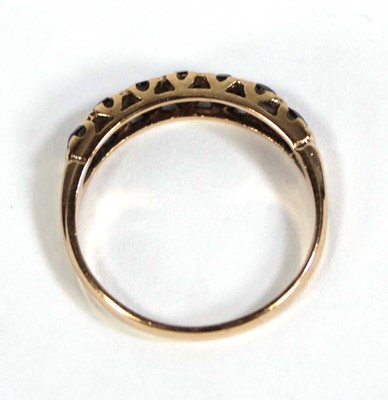 Lot 569 - A 9ct yellow gold half eternity ring set...