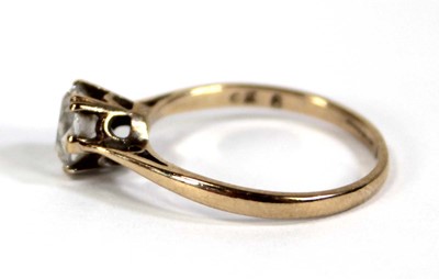 Lot 571 - A 9ct yellow gold ring set paste in a six claw...