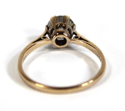 Lot 571 - A 9ct yellow gold ring set paste in a six claw...