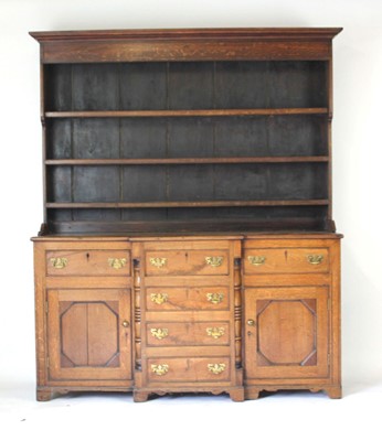 Lot 1 - A George III and later oak breakfront dresser,...