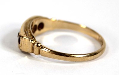 Lot 577 - An 18ct yellow gold ring set three small...