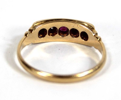 Lot 577 - An 18ct yellow gold ring set three small...