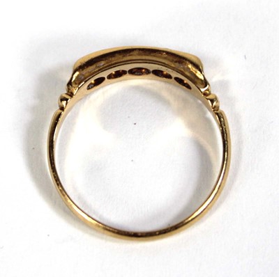 Lot 577 - An 18ct yellow gold ring set three small...