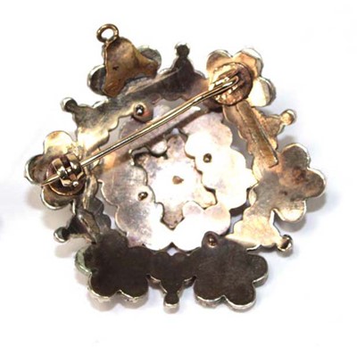 Lot 580 - A gold plated garnet brooch/pendant of...