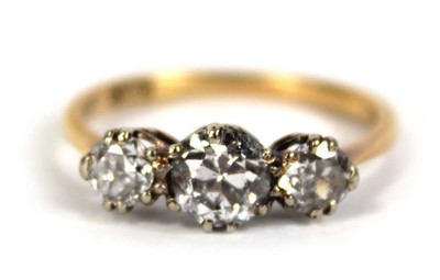 Lot 583 - An 18ct yellow gold ring set three graduated...