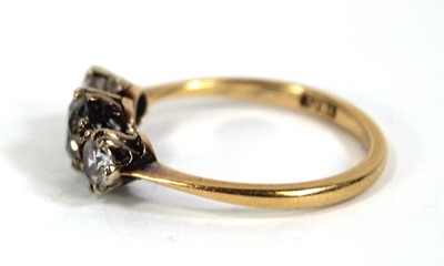 Lot 583 - An 18ct yellow gold ring set three graduated...