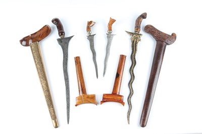 Lot 54 - Two large Kris daggers, with 13½ ins and 14½...
