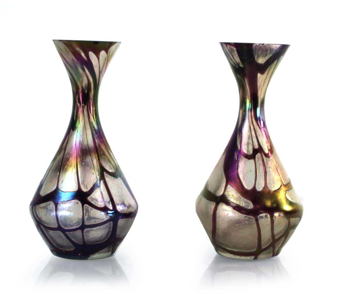 Lot 45 - In the manner of Loetz, a pair of iridescent...
