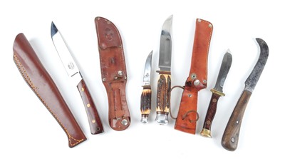 Lot 64 - Four together: Pat Mitchell sheath knife, 5¾...
