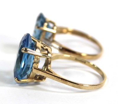 Lot 701 - Two 9ct yellow gold dress rings set pale blue...