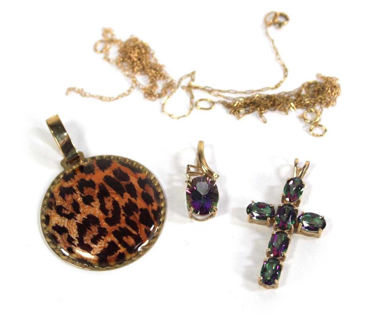 Lot 702 - Three 9ct yellow gold pendants including a...