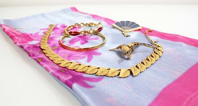 Lot 713 - Four items of Trifari costume jewellery...
