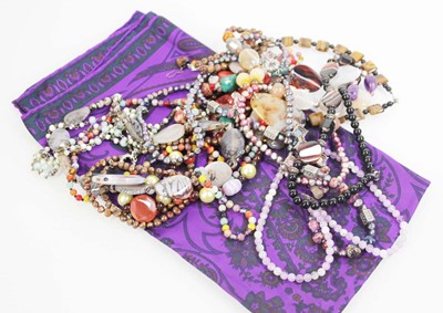Lot 714 - A group of beaded jewellery including a tigers...