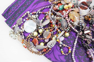 Lot 714 - A group of beaded jewellery including a tigers...