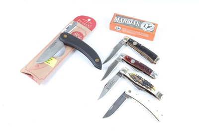 Lot 1115 - Four various Marbles pocket knives, together...