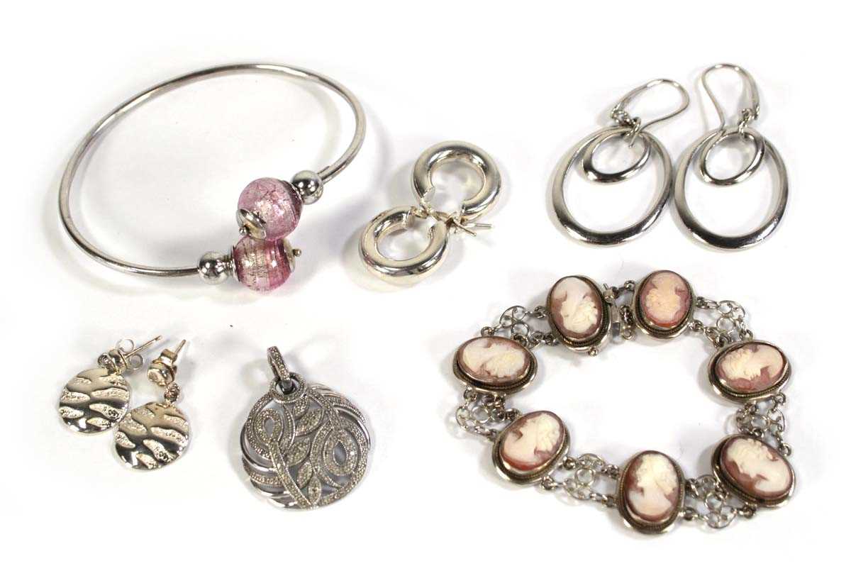 Lot 590 - A group of silver jewellery comprising a...