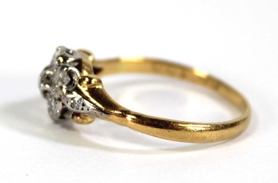 Lot 593 - An 18ct yellow gold cluster ring set seven...