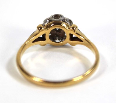 Lot 593 - An 18ct yellow gold cluster ring set seven...