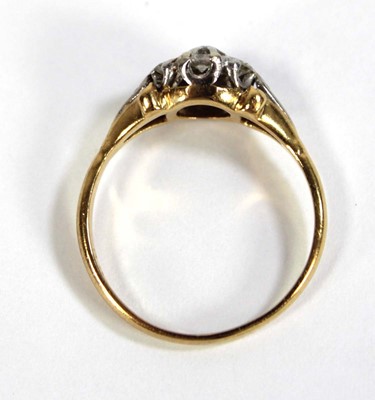 Lot 593 - An 18ct yellow gold cluster ring set seven...