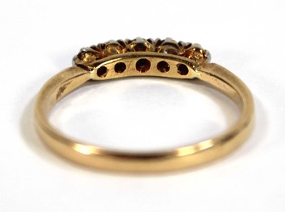 Lot 595 - An 18ct yellow gold ring set five small...