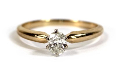 Lot 596 - A 14ct yellow gold ring set oval diamond in a...