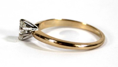 Lot 596 - A 14ct yellow gold ring set oval diamond in a...