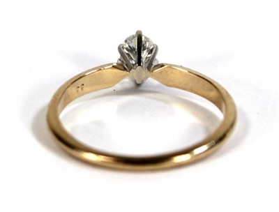 Lot 596 - A 14ct yellow gold ring set oval diamond in a...