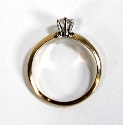 Lot 596 - A 14ct yellow gold ring set oval diamond in a...