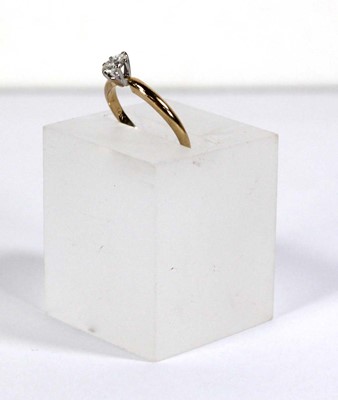 Lot 596 - A 14ct yellow gold ring set oval diamond in a...