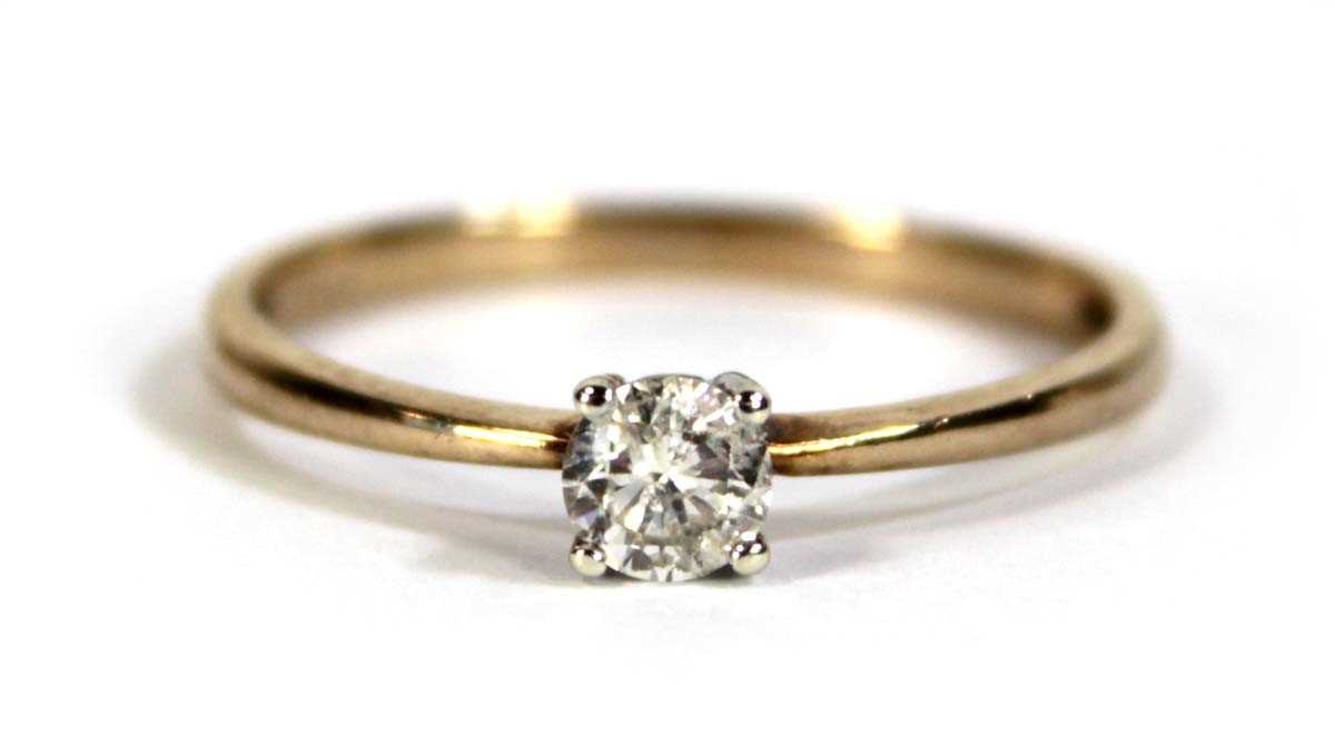 Lot 597 - A 9ct yellow gold ring set brilliant cut...