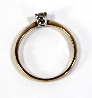 Lot 597 - A 9ct yellow gold ring set brilliant cut...