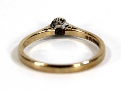 Lot 599 - A 9ct yellow gold ring set small diamond in an...