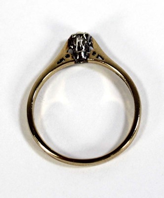 Lot 599 - A 9ct yellow gold ring set small diamond in an...