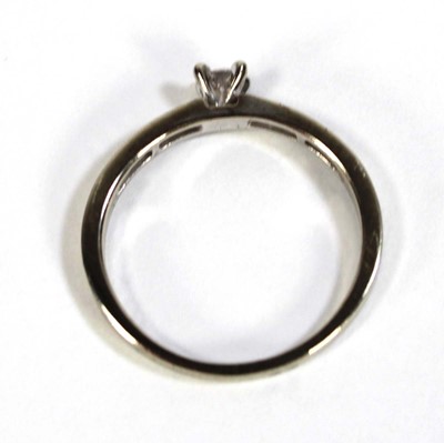 Lot 600 - A 9ct white gold ring set small diamond in a...