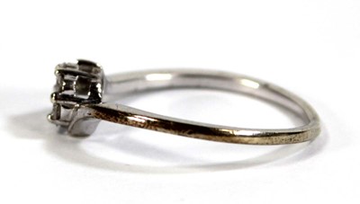Lot 601 - A 9ct white gold cluster ring set seven small...