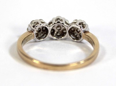 Lot 602 - A 9ct yellow gold triple cluster ring set...