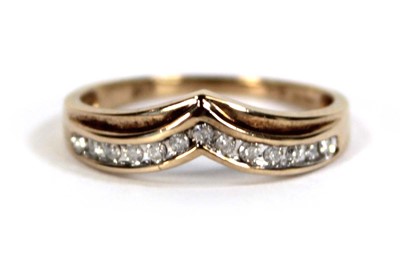 Lot 603 - A 9ct yellow gold ring set a row of small...