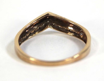 Lot 603 - A 9ct yellow gold ring set a row of small...