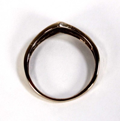 Lot 603 - A 9ct yellow gold ring set a row of small...