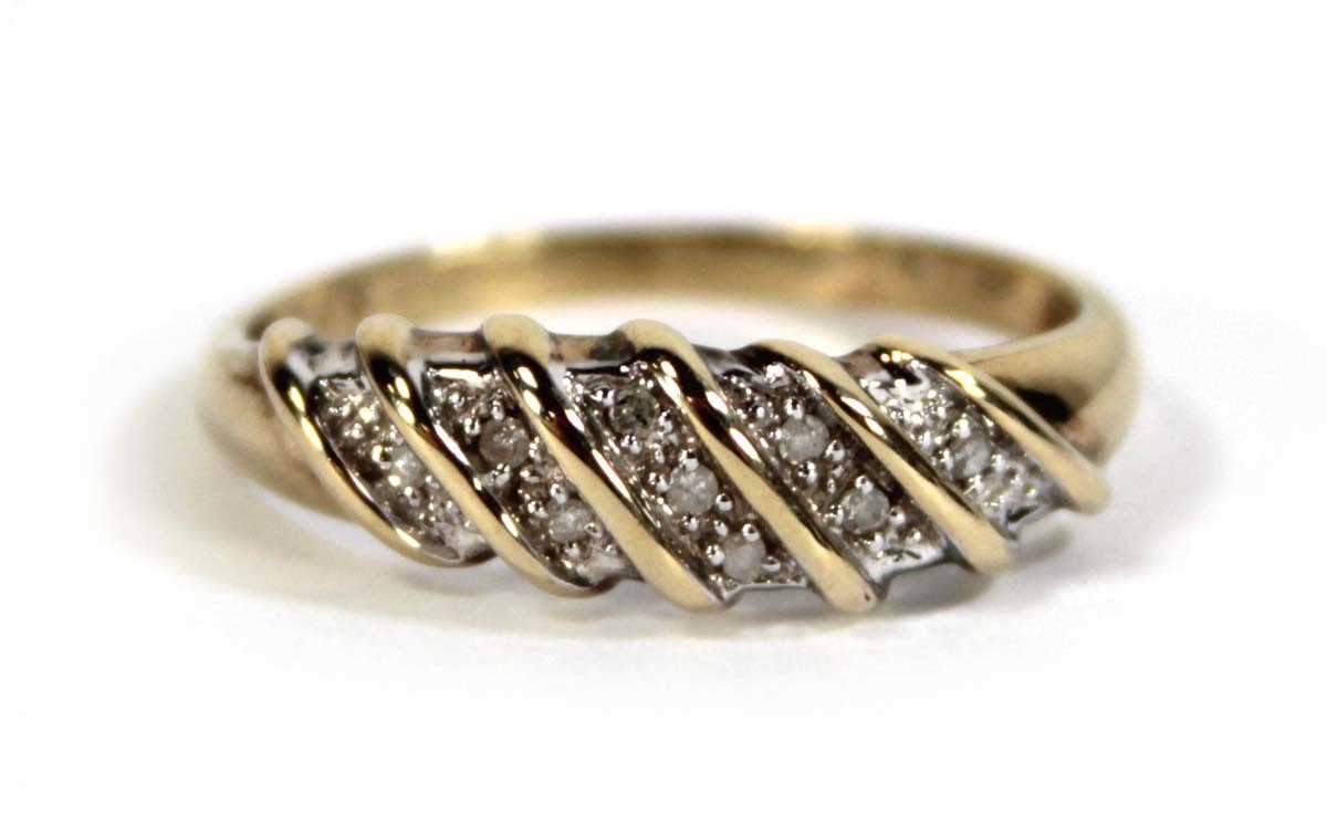 Lot 604 - A 9ct yellow gold ring set five rows of small...