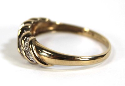 Lot 604 - A 9ct yellow gold ring set five rows of small...