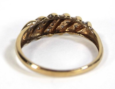 Lot 604 - A 9ct yellow gold ring set five rows of small...