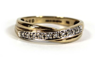 Lot 605 - A 9ct yellow gold ring set small diamonds in a...