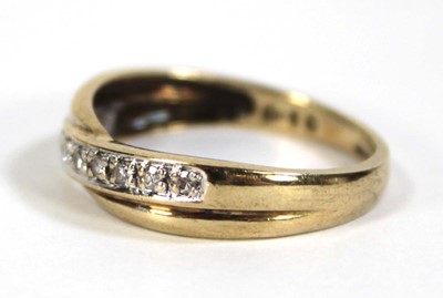 Lot 605 - A 9ct yellow gold ring set small diamonds in a...